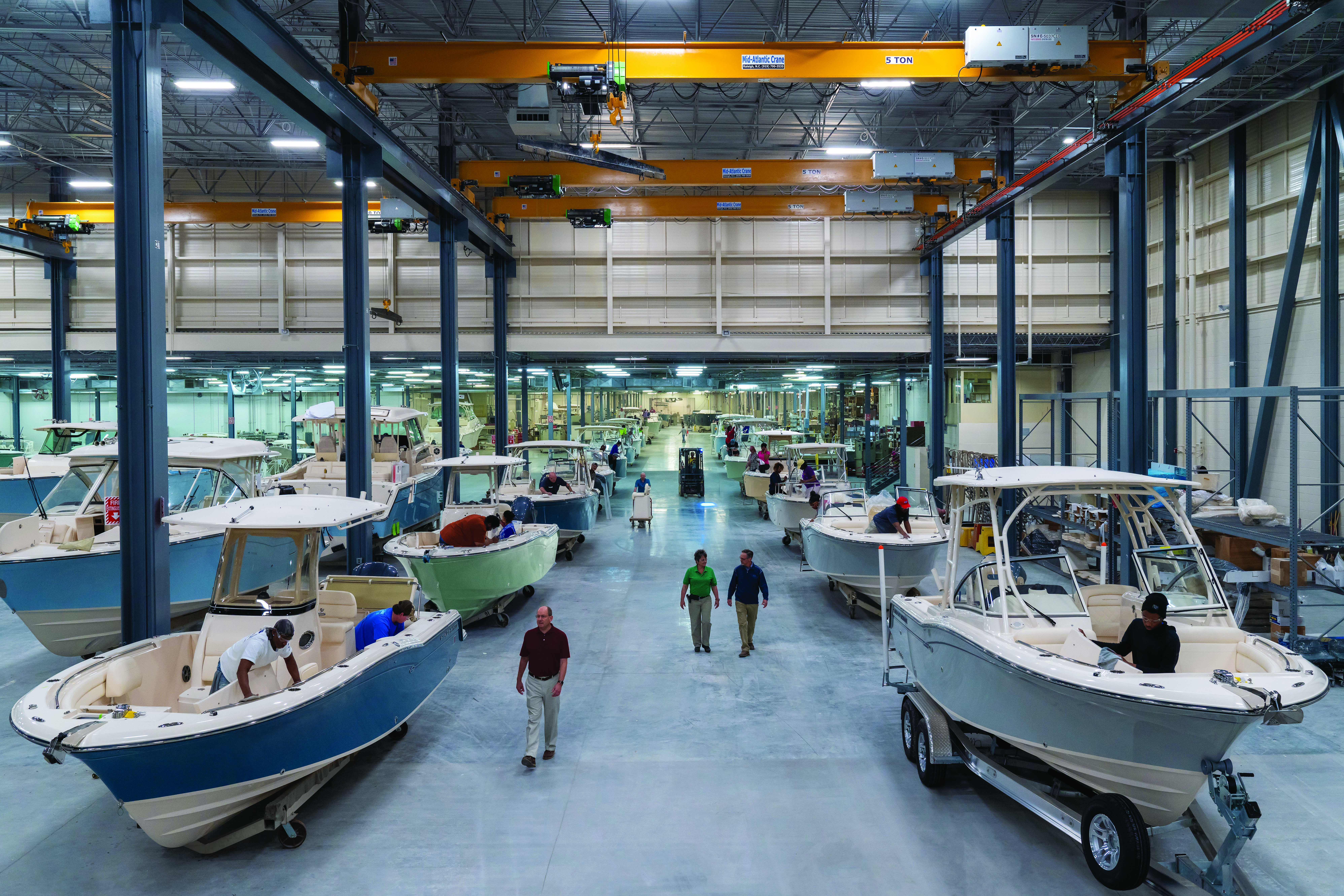 Interior view of the Grady-White plant showing boats lined up in production
