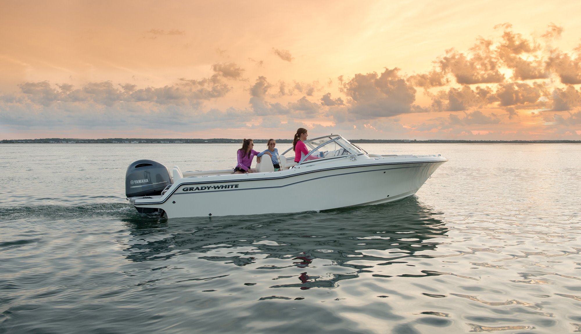 Grady-White Freedom 215 21-foot dual console starboard side with friends