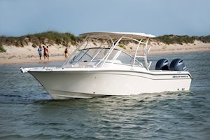 Grady-White Freedom 255 25-foot dual console boat port side with family on beach