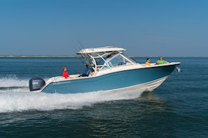 Grady-White Freedom 325 32-foot dual console fishing boat running out of inlet