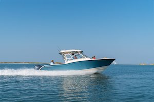 Grady-White Freedom 325 32-foot dual console fishing boat running inshore