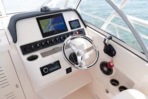 Grady-White's Adventure 218 21-foot walkaround cabin boat helm layout with steering wheel