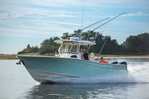 Grady-White Canyon 306 30-foot center console boat running bow forward port side