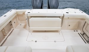 Grady-White Freedom 325 32-foot dual console fishing boat cockpit with fold-away aft bench seat and transom door