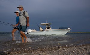 Grady White 281 CE at Beach With Fisherman on Shore