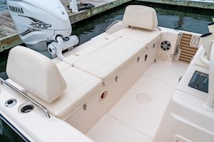 Grady White 281 CE Aft Bench Seat with port and starboard swing-open walk-through backrests and seat cushions