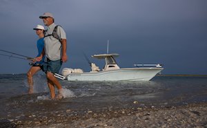 Grady White 281 CE at Beach With Fisherman on Shore